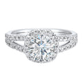 Cushion halo is a stunning way to showcase the round solitaire diamond. Modern split diamond studded shank further highlights the center. - W0081RC100SM-4WB