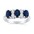 Luxurious Three Stone Oval Sapphire Ring With Round Two Stone Diamond Details