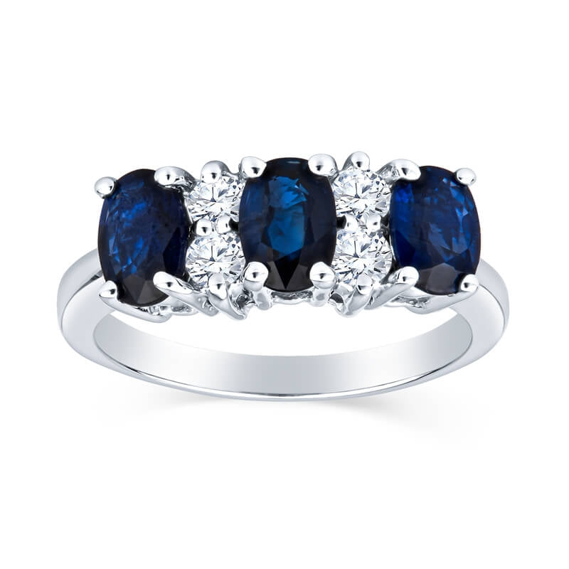 Luxurious Three Stone Oval Sapphire Ring With Round Two Stone Diamond Details