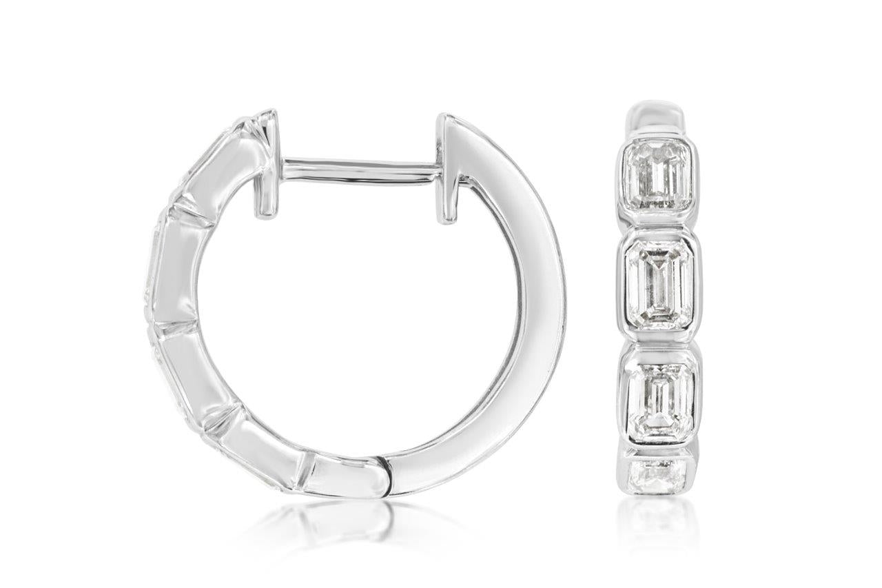Discover the ultimate blend of modern elegance with our 14K White Gold Bezel Diamond Hoops. Each precisely cut diamond, securely set in a sleek bezel, captures and reflects light with dazzling brilliance, illuminating your every movement.  These exquisite